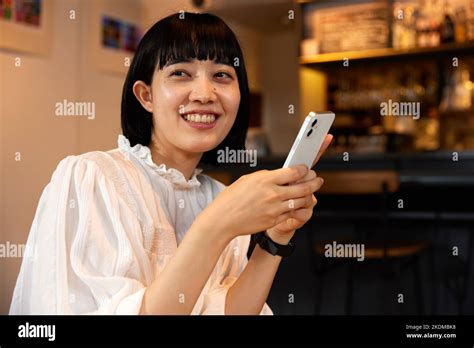 Japanese Woman At A Cafe Stock Photo Alamy