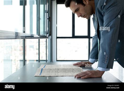 businessman reading finance section  newspaper stock photo alamy