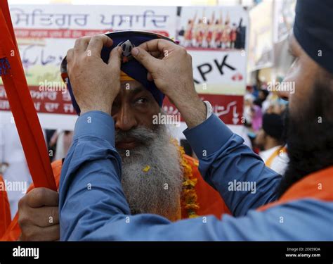 Sikh Devotees Prepare As They Participate In The Baisakhi Festival At