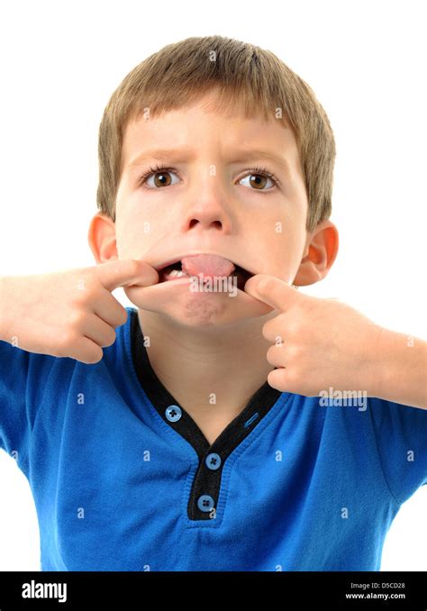 Little boy sticking out tongue with funny face Stock Photo - Alamy