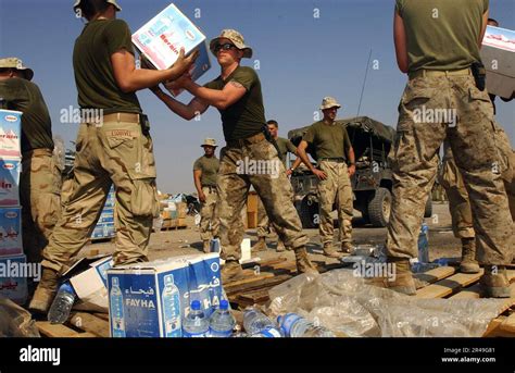 US Navy Marines from the 13th Marine Expeditionary Unit (MEU) load ...