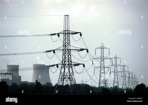 Power Lines Pylons And Cooling Towers Stock Photo Alamy