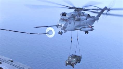 CH-53E Helicopter Perform Air Refueling While Carrying A Humvee ...