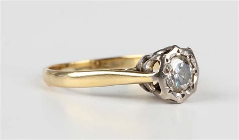 A Gold And Diamond Single Stone Ring Mounted With A Circular Cut