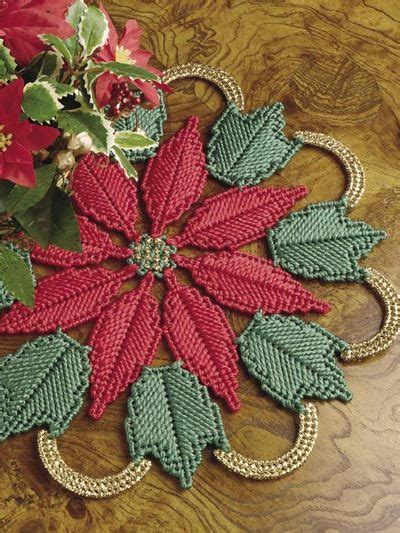 A Wooden Table Topped With A Red And Green Poinsettia Decoration On Top Of It