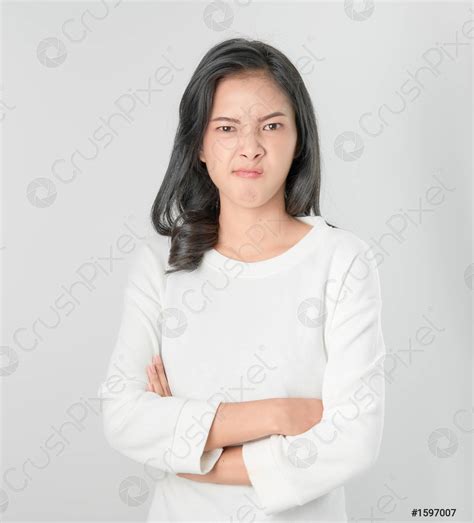 Asian Woman Face Angry And Crossed Arms On Gray Background Stock