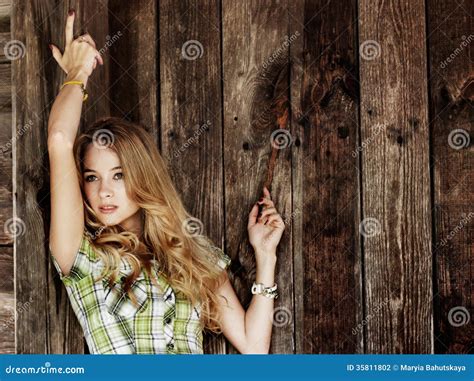Portrait Of Blonde Woman At The Wooden Wall Stock Photo Image Of Desire Longhaired