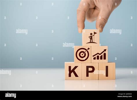 KPI Key Performance Indicator Businessman Holds Cube With KPI Icon