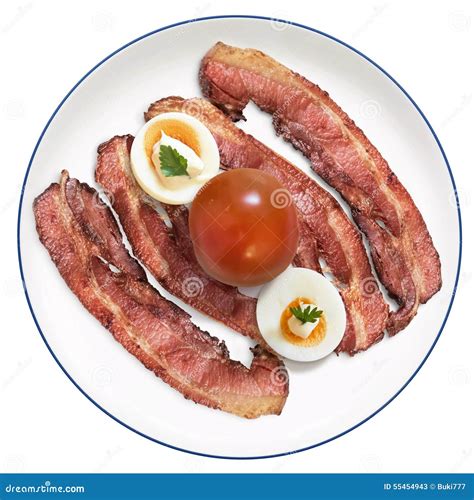 Fried Bacon Rashers With Hard Boiled Garnished Egg Slices And Tomato