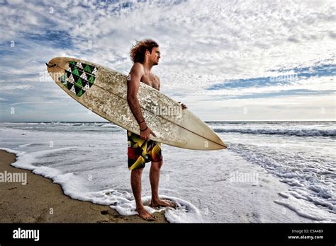 Man Holding Surfboard Hi Res Stock Photography And Images Alamy