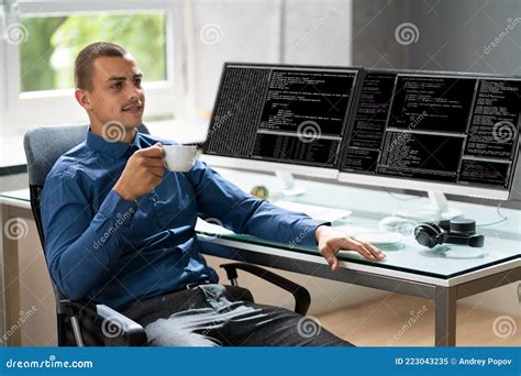 Computer Programmer Writing Program Code On Computer Stock Image