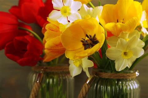 Premium Photo Beautiful Bouquet Of Tulips And Narcissus On Wooden