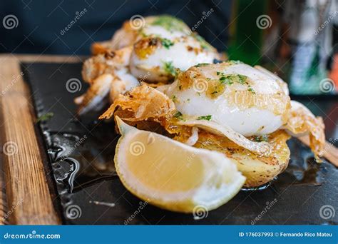 Grilled Cuttlefish With Garlic Sauce And Parsley Healthy Food Close Up