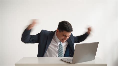 Happy Office Worker In Formal Clothes Jacket And Tie Works At Laptop