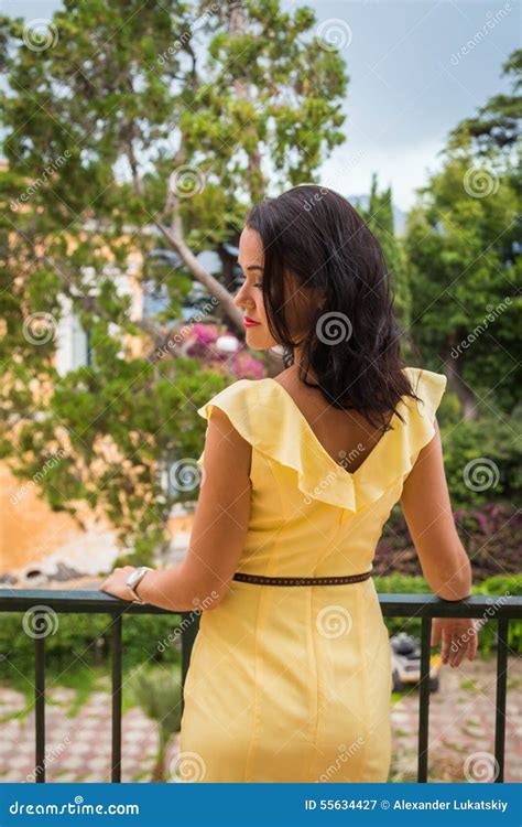 Beautiful Brunette In A Yellow Dress Stock Image Image Of Luxuriant Portrait 55634427