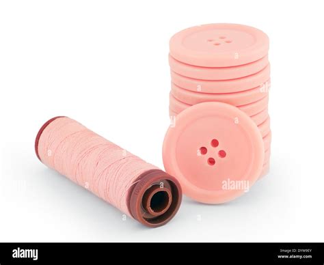 pink sewing buttons and thread isolated on white Stock Photo - Alamy