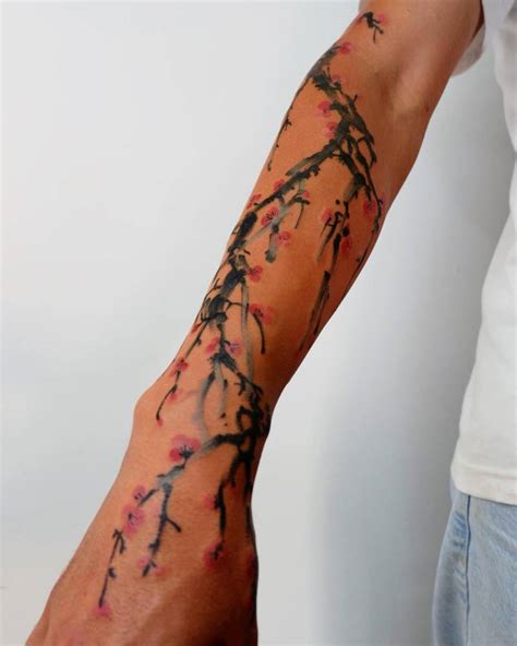 Watercolor Style Cherry Blossom Tattoo Located On The