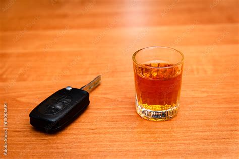 A Glass Of Whiskey And Car Keys On The Table Drunk Driving Drink And Auto Keys To Drive Or Not