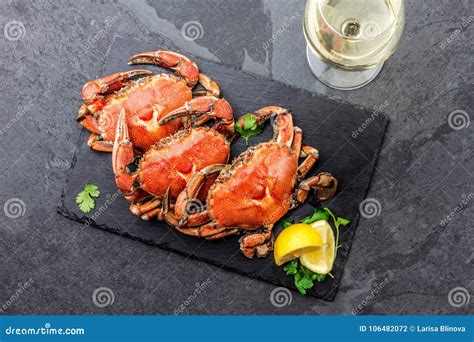 Cooked Whole Crabs On Black Plate Served With White Wine Black Slate