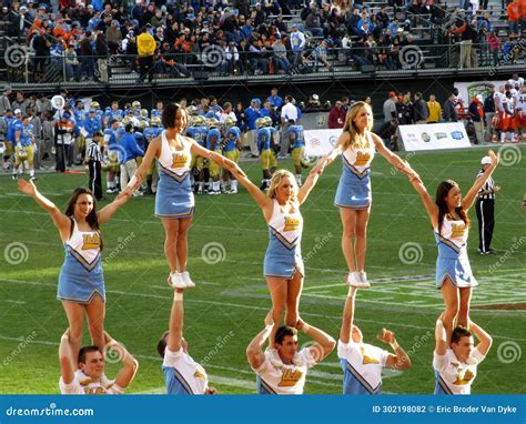 Cheerleaders Performing On Football Field Editorial Image