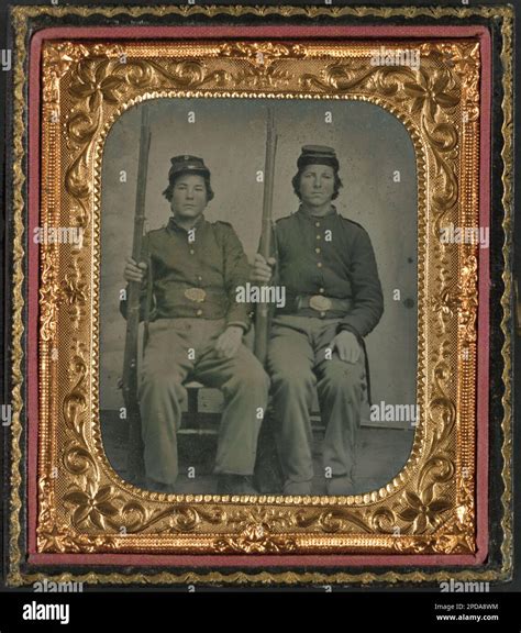 Two Unidentified Soldiers In Union Uniforms Holding Muskets