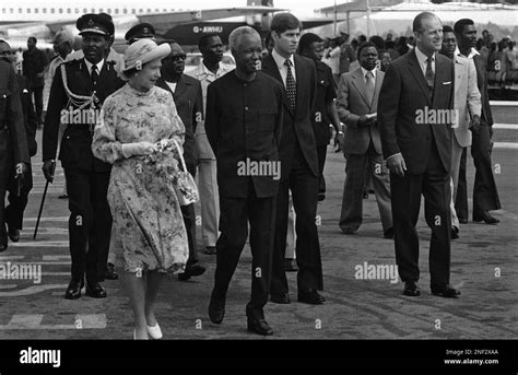 Queen Elizabeth Ii Walks With President Julius Nyerere While Prince