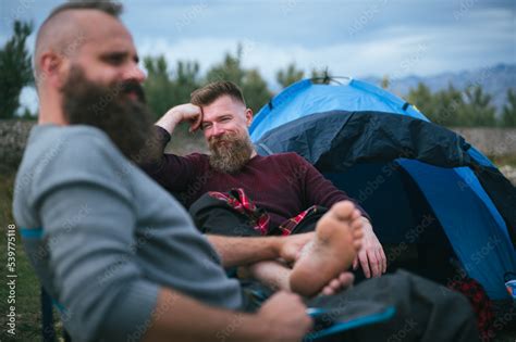 Hipster Long Beard Gay Couple Camping On Open Grass Field Attractive Male Homosexuals Relaxing