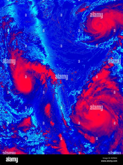 Color Coded Satellite Photograph Of Three Tropical Storms Stock Photo