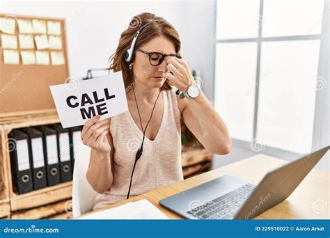 Middle Age Brunette Woman Wearing Operator Headset Holding Call Me