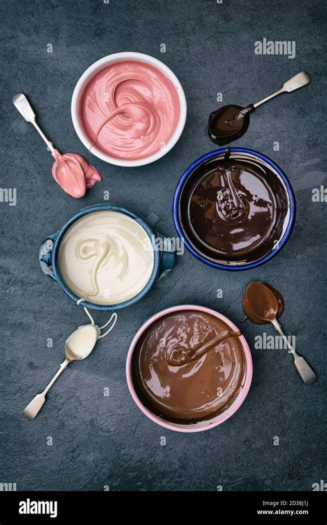 Four Types Of Melted Chocolate In Bowls Dark Chocolate Milk Chocolate White Chocolate And