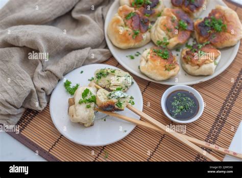 Shanghai Pan Fried Pork Dumpling With Wild Garlic Stock Photo Alamy