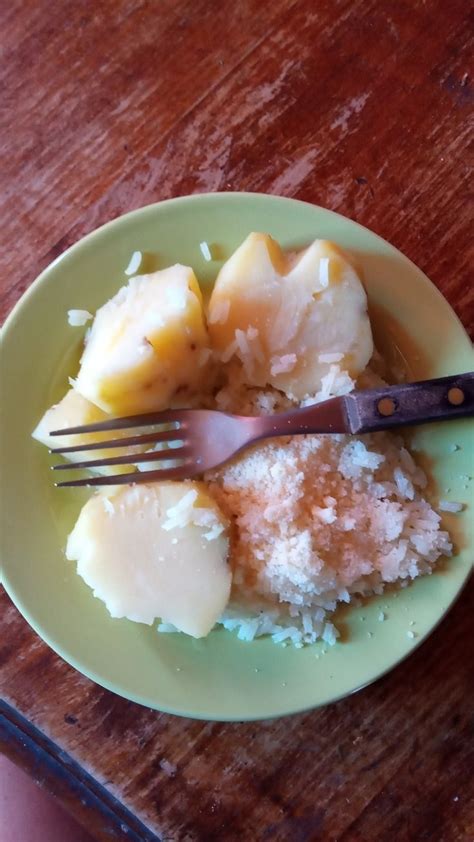 A Green Plate Topped With Food And A Fork