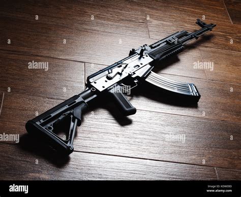 Custom build Kalashnikov assault rifle AKM on wooden floor Stock Photo ...