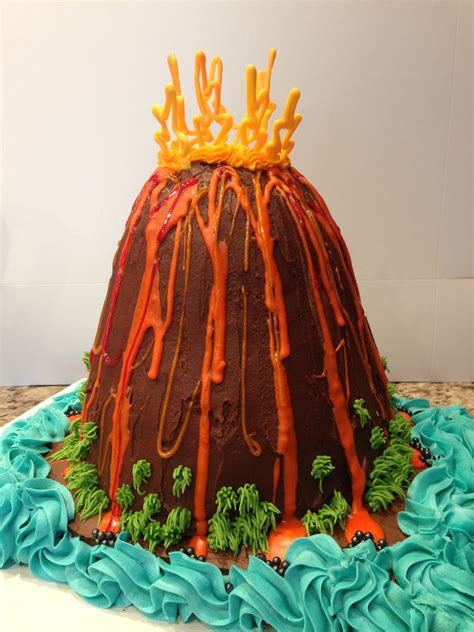 Chocolate Volcano Cake With Whites Chocolate Flames And Stuffed With Orange Sixlets As Lava