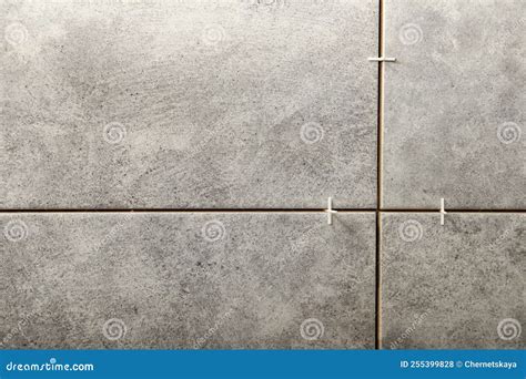 Stylish Tiles With Spacers On Wall In Room Stock Photo Image Of