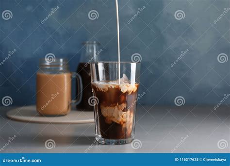 Pouring Milk Into Glass With Cold Brew Coffee Stock Image Image Of