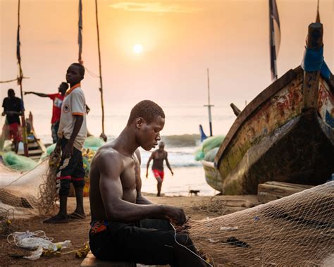 Sunrise Fisherman Fixing Nets Dawn Cape Coast Ghana Africa