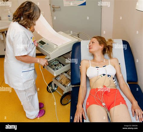 Woman Undergoing Electrocardiography Ekg Examination Hi Res Stock