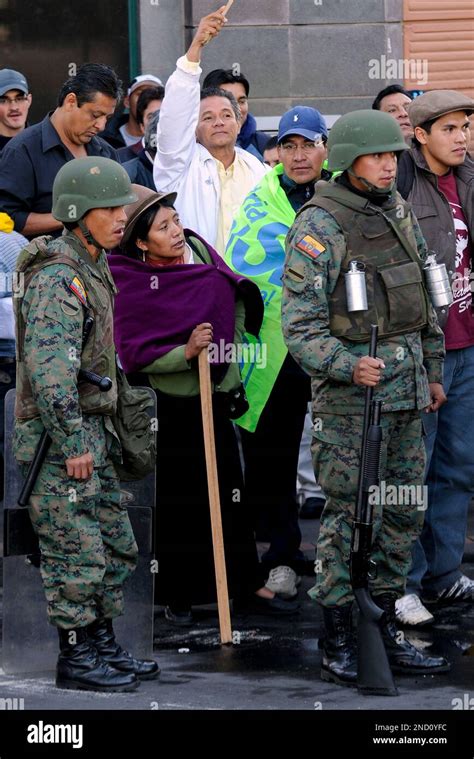 People Demonstrate Next To Soldiers At The Surroundings Of The