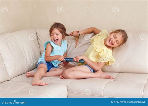 Angry Siblings Sitting Arms Crossed With Sad Mother On Sofa Royalty