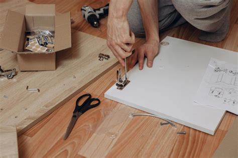 Premium Photo Crop Male With Screwdriver Assembling New Wooden