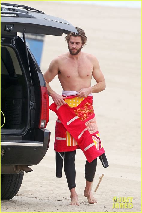 Liam Hemsworth Goes Shirtless While Surfing In Malibu Photo