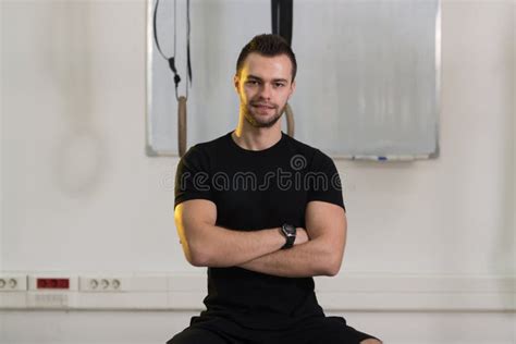 Portrait Of Personal Trainer With Clipboard In Modern Gym Stock Image