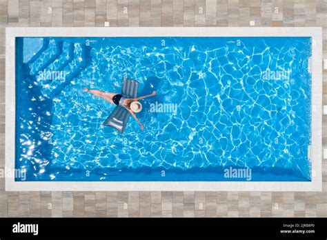 Woman Swimming With Pool Raft In Pool Stock Photo Alamy