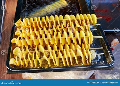 Potatoes Cut Into A Spiral And Fried Tornado Potato Stock Photo