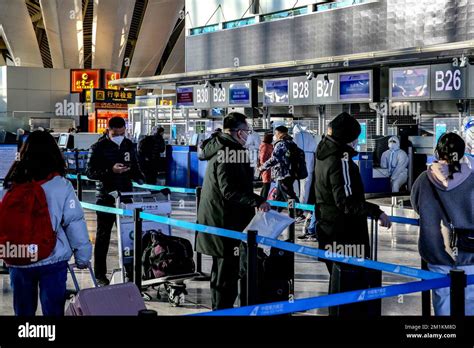 Passengers Lined Up To Check In At Terminal T Of Urumqi Diwopu