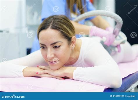 Woman In Special White Suit Having A Anti Cellulite Massage With Spa