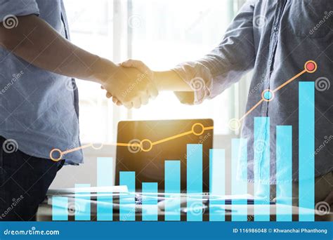 businessman shaking hands  finance graph stock photo image