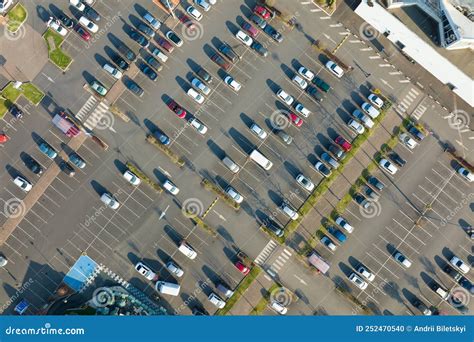 Aerial View Of Many Colorful Cars Parked On Parking Lot With Lines And