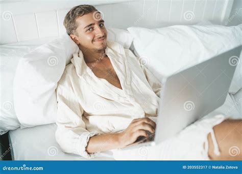 Man Laying in Bed and Working on Laptop Stock Image - Image of watch ...